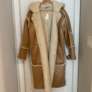 Reversible hooded shearling coat